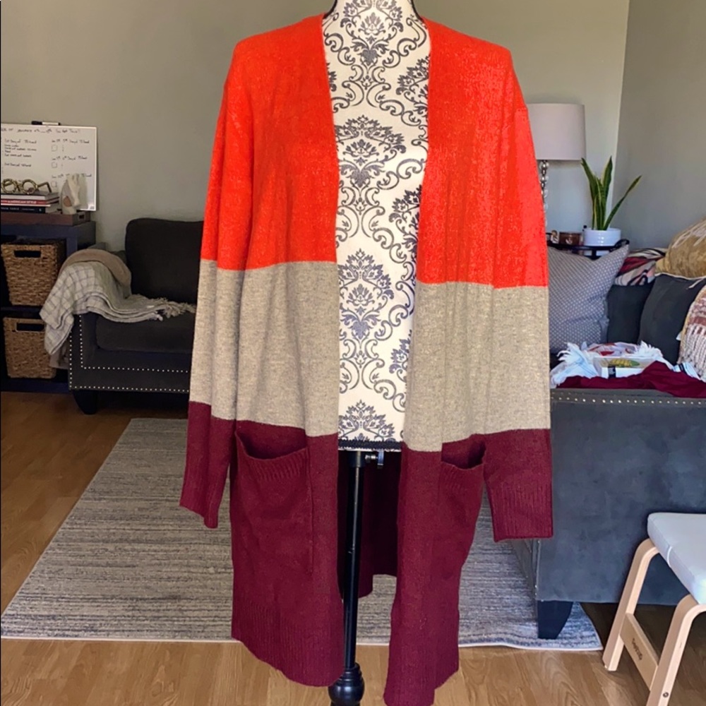 A. New day long soft sweater. NWT size M